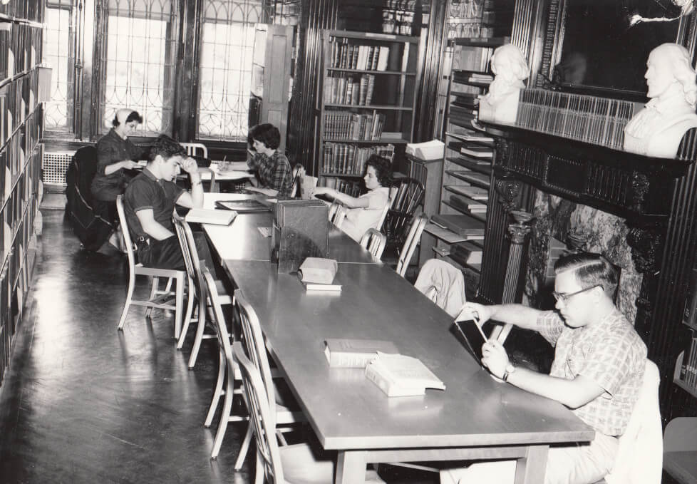 Students in the original library on the third floor of Kirby Hall.