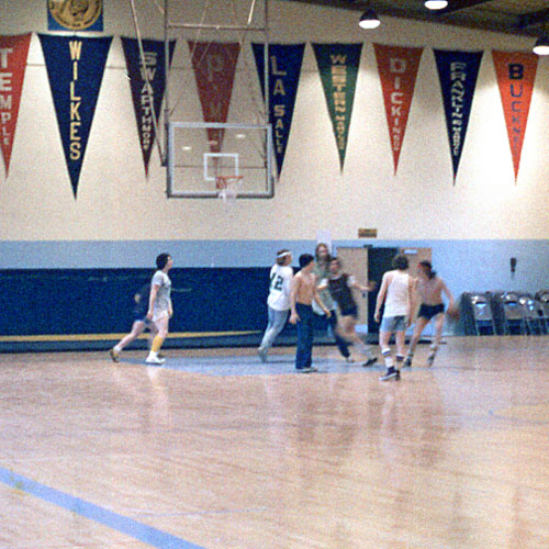 Wilkes students playing basketball in The Old Gymnasium prior to Hurricane Agnes.