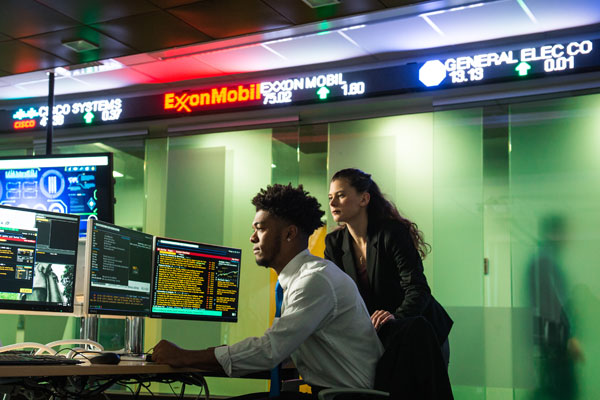 Students working in the Sidhu School Financial Center.