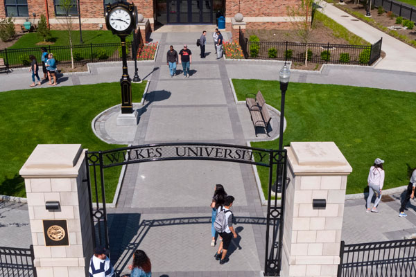 Students walking near the South Campus Gateway.