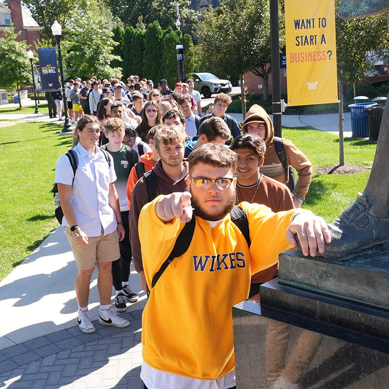 Wilkes students using a laptop