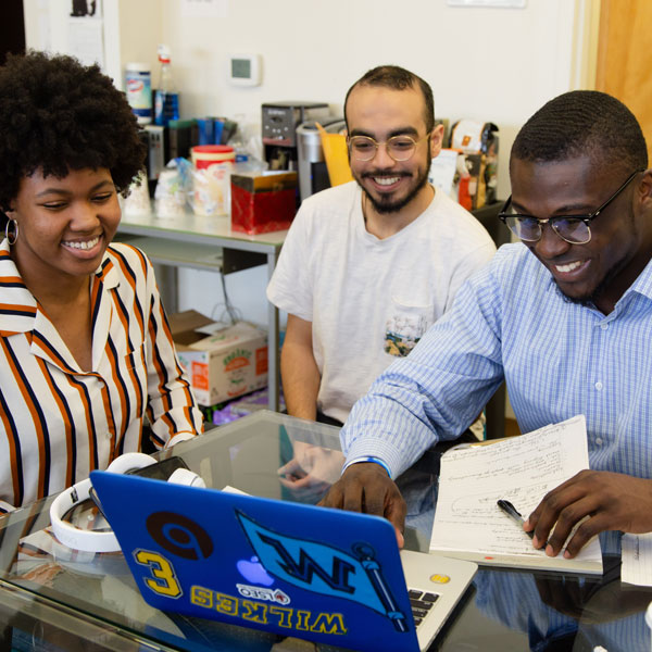 Wilkes students using a laptop