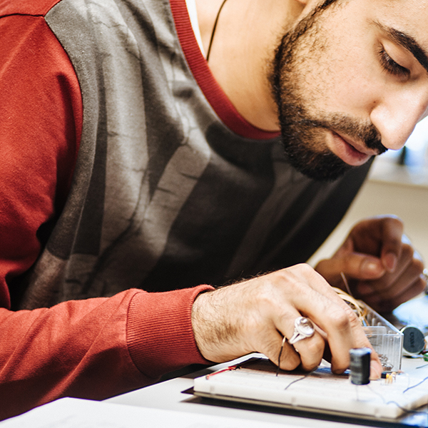 a student working on a circuit board