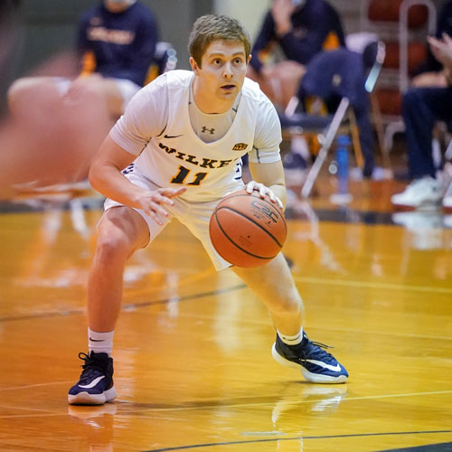 Landon Henry during game with Wilkes Basketball
