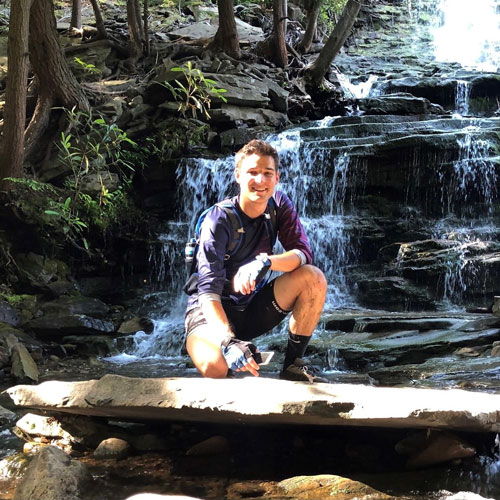Lucas Snedeker outdoors by falls