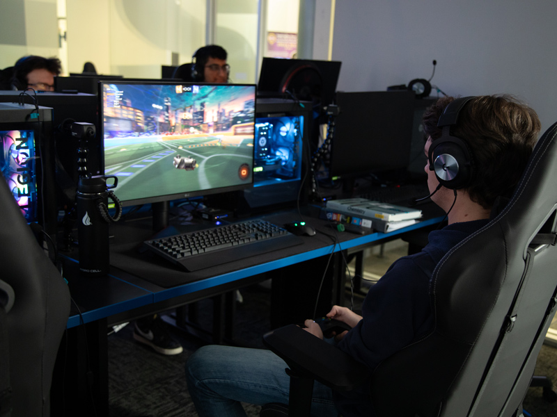 Students in the Wilkes Esports center playing Rocket League