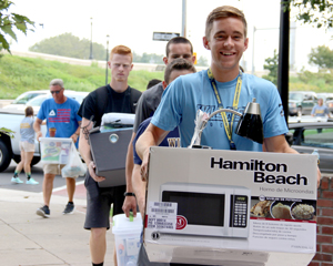 Wilkes students moving boxes during Move-In Day